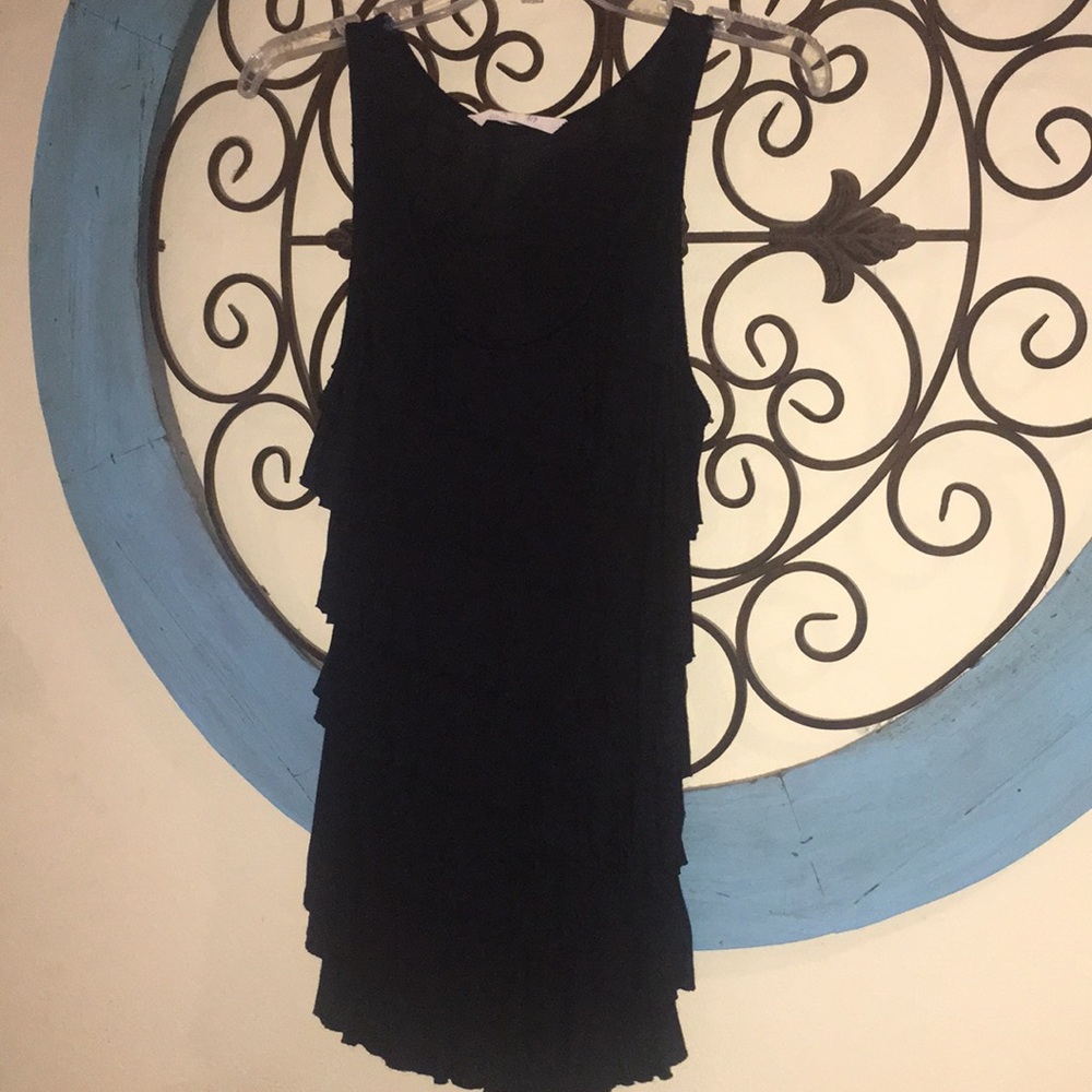 Ruffled black tank top.